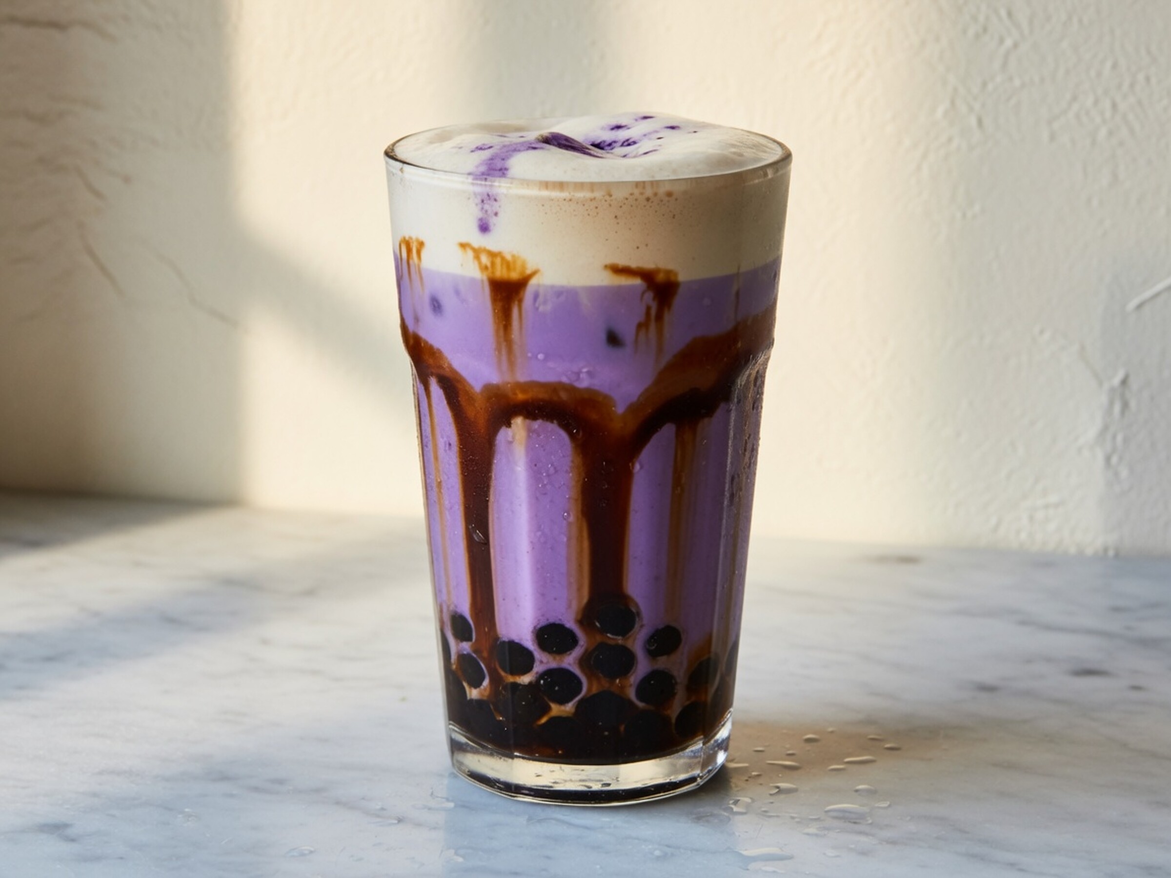 Iced ube brown sugar latte with boba